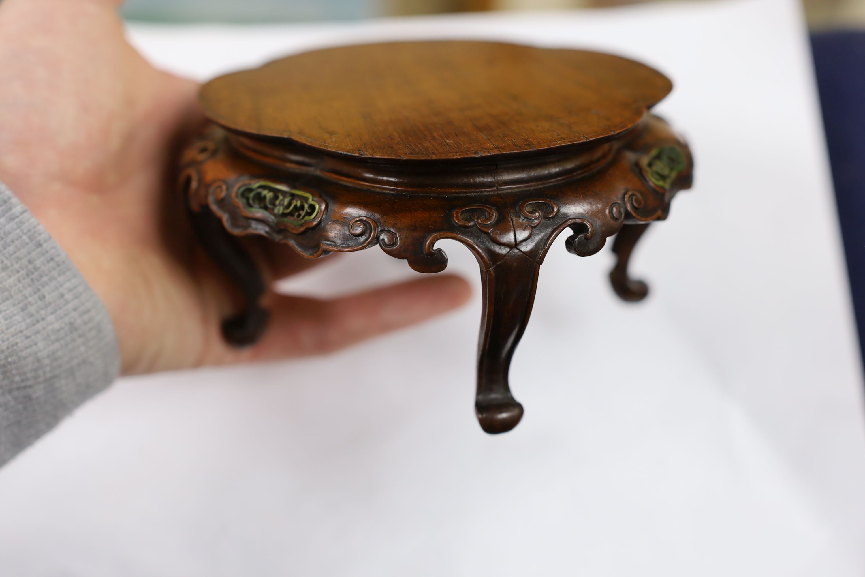 A fine Chinese oval hardwood and green stained Ivory inset stand, Qing dynasty, lacking stretcher, 15 cms wide.